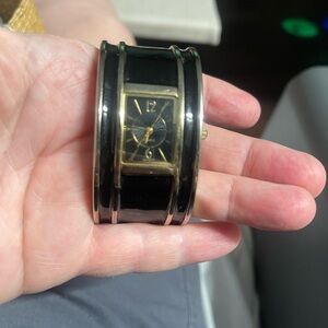 Elegant Black and Gold Women's Cuff Watch